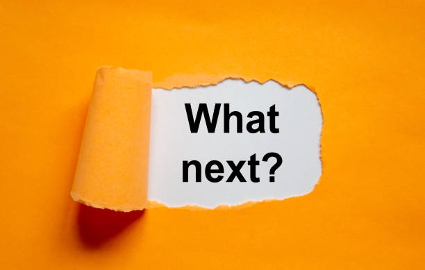 istock The text 'what next' appearing behind torn orange paper. Business concept, copy space. 1263905443