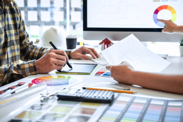 istock Team design of young Interior graphic designer working house project sketching on graphic tablet and color swatch working at modern office, creative inspiration and imagine 1263907166