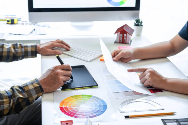 istock Team design of young Interior graphic designer working house project sketching on graphic tablet and color swatch working at modern office, creative inspiration and imagine 1263907171