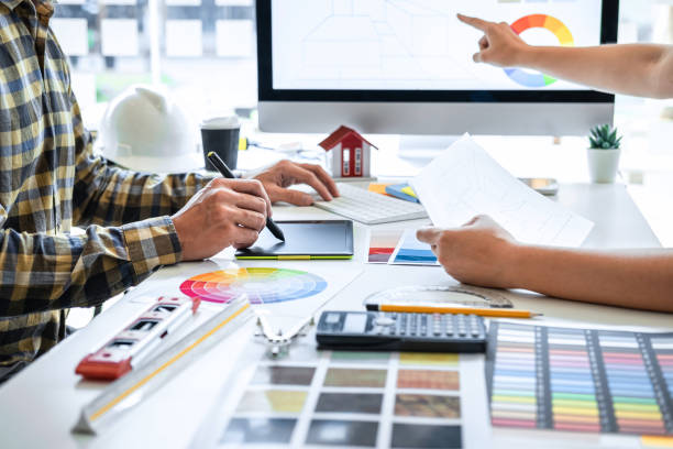 istock Team design of young Interior graphic designer working house project sketching on graphic tablet and color swatch working at modern office, creative inspiration and imagine 1263907173