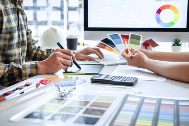 istock Team design of young Interior graphic designer working house project sketching on graphic tablet and color swatch working at modern office, creative inspiration and imagine 1263907176