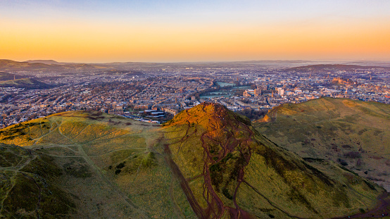 Aerial view of city and hill at sunset