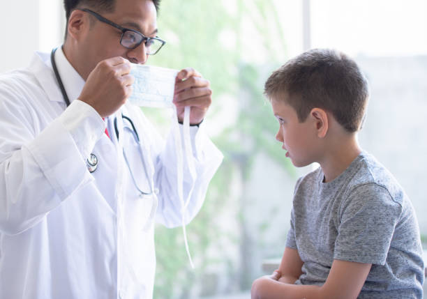 istock Learning how to wear a mask at the doctor's 1263908098