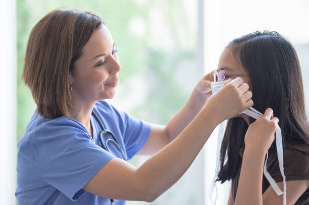 istock Learning how to wear a mask at the doctor's 1263908125