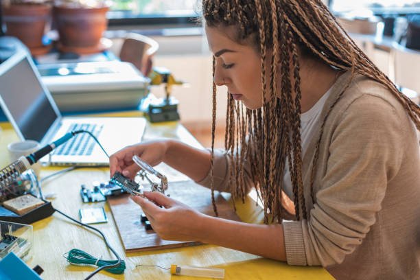 istock Technician checks the electronic device stock photo 1263908736