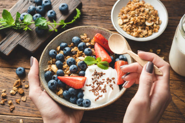 istock Eating granola with greek yogurt and berries 1263910071