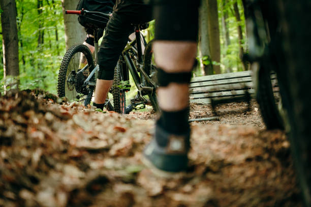 istock Legs of cyclists in forest 1263910224