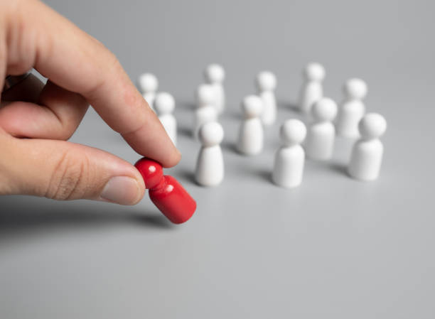 istock Hand chooses a icon people standing out from the crowd,Successful team leader 1263910496