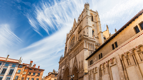 Majestic ancient architecture of Saint-Jean-Baptiste Cathedral monument in Lyon old town, in Vieux Lyon district. Photo taken in Lyon famous city, Unesco World Heritage Site, in Rhone department, Auvergne-Rhone-Alpes region in France, Europe during a sunny summer day.