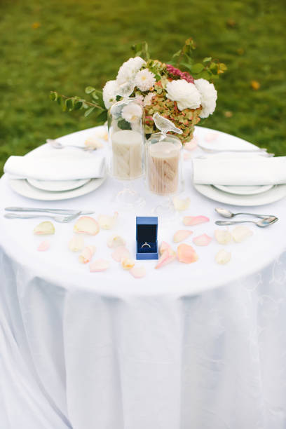 istock Engagement. Romantic dinner. Festive table setting with an engagement ring, proposal to get married. 1263912640