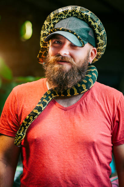 Unusual Wild Pet Python, Snake, Man, Hipster, Portrait snakes beard stock pictures, royalty-free photos & images