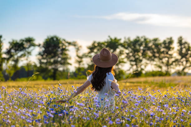 istock Woman standing on field 1263914401