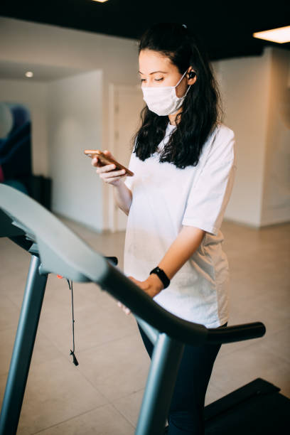 istock Woman training in gym during covid-19 1263915042