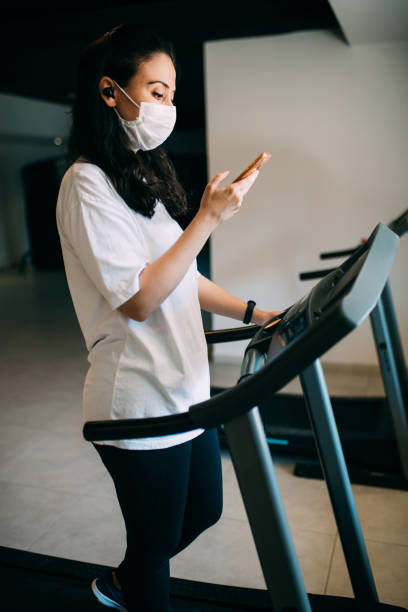 istock Woman training in gym during covid-19 1263915623