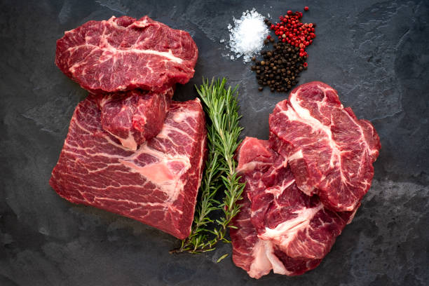 istock Fresh Beef shoulder Blade on the stone table - Top Blade steaks cut from a whole piece 1263915941