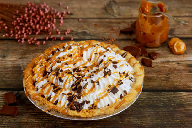 homemade pie with wipped cream and caramel sauce. - wipped cream imagens e fotografias de stock