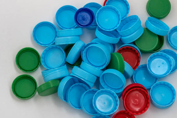 istock Color covers for plastic bottles with drink on white background. Red, blue and green plastic covers. 1263916872