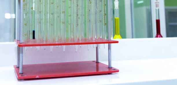 laboratory test tubes on the stand. stand on the table. - reaction tube imagens e fotografias de stock