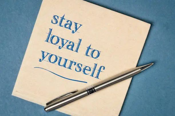 stay loyal to yourself inspirational note - handwriting on a napkin, integrity and personal development concept