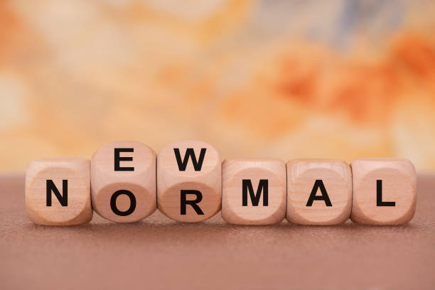 istock normal and new written on wooden cube 1263918404