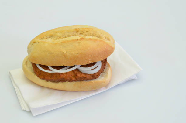 istock Hamburger with Onion rings in Bun on white Napkin 1263922491