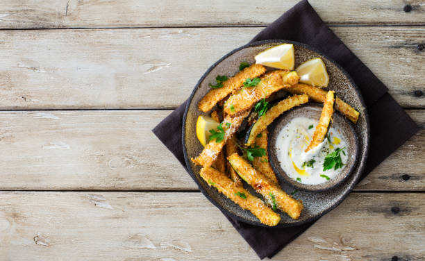 istock Zucchini sticks baked with parmesan cheese and bread crumble 1263922695