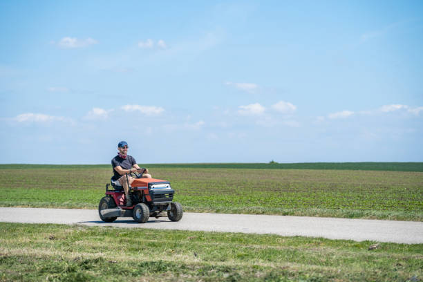 istock gardener on a lawn mower 1263922764