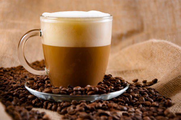 istock Coffee beans scattered around a cup of coffee 1263924457