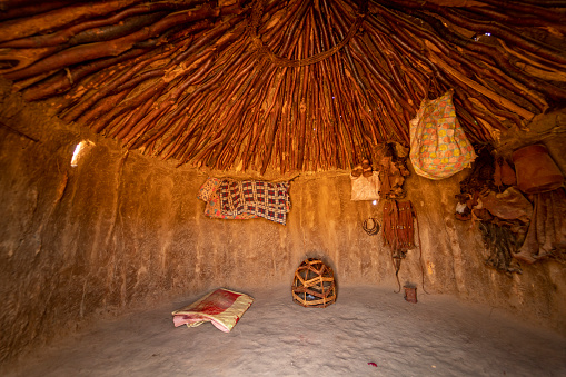 Interior of tribal hut with accessories