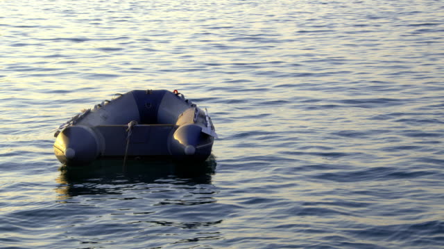 Plastic Boat Floating in the Shimmering Sea Footage