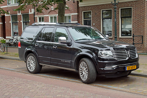 Medemblik, the Netherlands - July 22, 2020: Black Lincoln Navigator parked by the side of the road. Nobody in the vehicle.