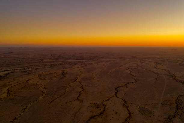 istock Sunrise over arid landscape 1263928820