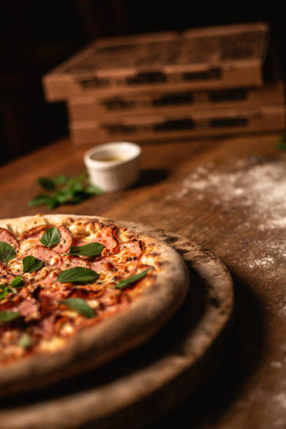 istock Delicious pizza on wood table 1263928965