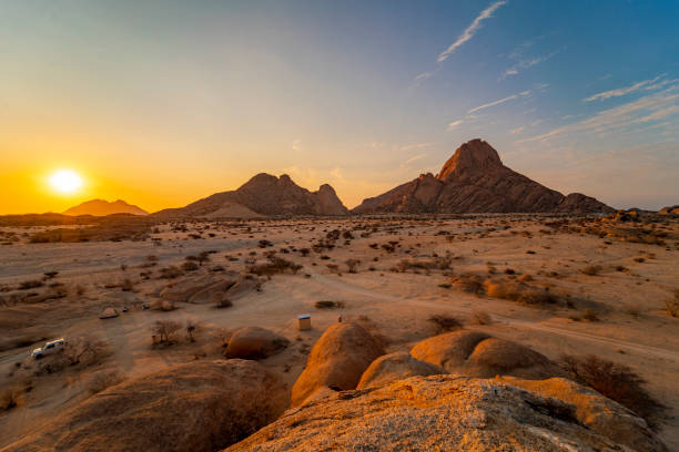 istock Sun rising over arid landscape 1263929461