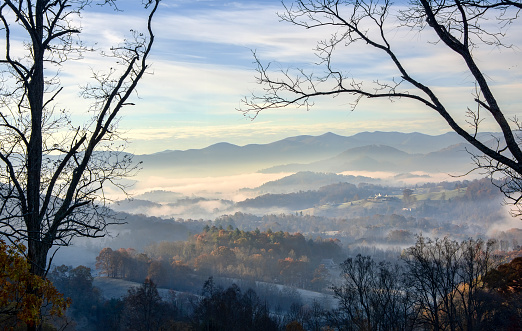Early morning fog rolls into the valley in Clyde, North Carolina