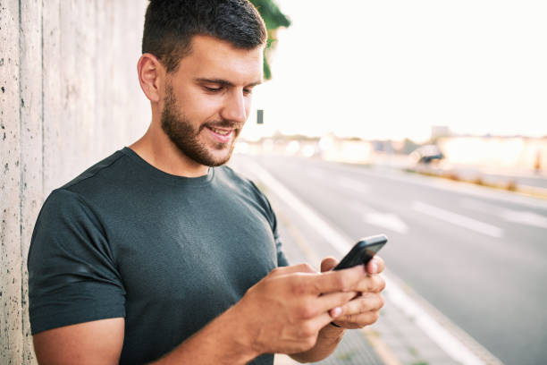 istock Young man with smart phone 1263930208