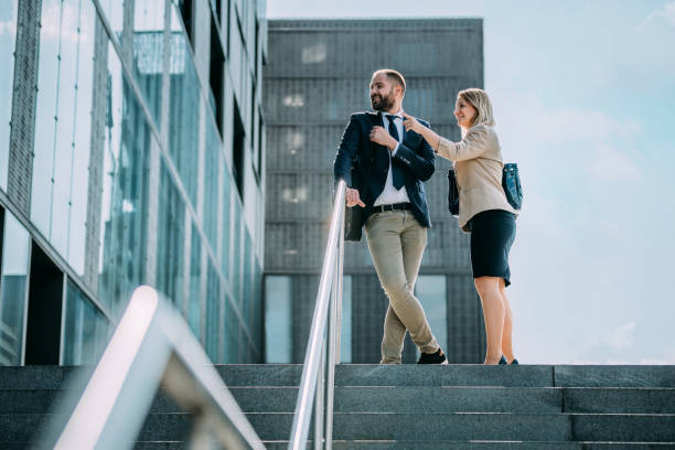 istock Man and woman smiling and looking at something 1263930641