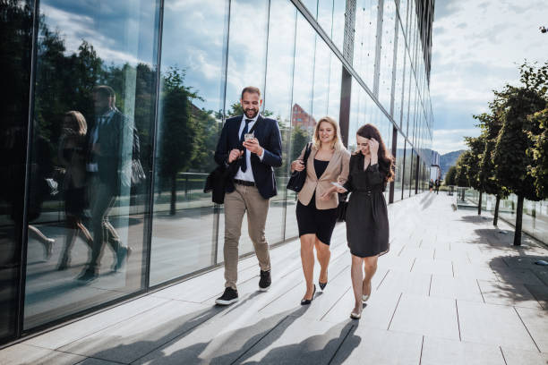 istock Pedestrians looking at smart phone screens 1263931751