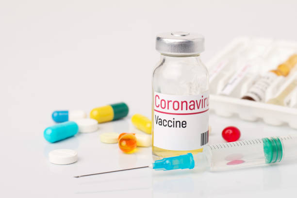 istock Small bottle and syringe on medicine table 1263932010