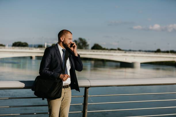 istock Man in suit talking on phone 1263932142