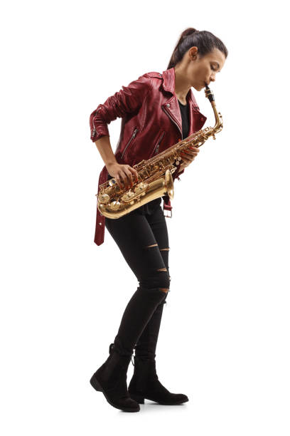 istock Young woman in a leather jacket playing a saxophone 1263932752