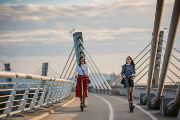 istock Friends on electric push scooters 1263933336