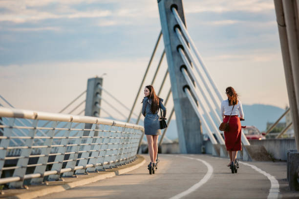 istock Two women on electric push scooters 1263933375