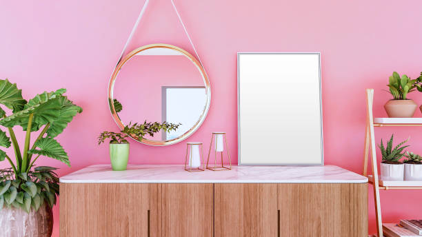 Blank empty picture frame for mock up on sideboard and pink wall, 3D Rendering Blank empty picture frame for mock up on sideboard and pink wall, 3D Rendering sideboard photos stock pictures, royalty-free photos & images
