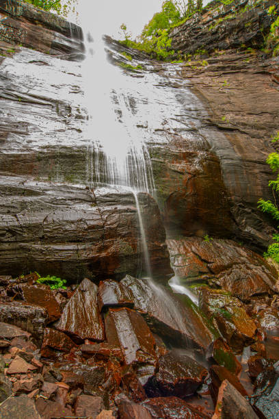 istock Beautiful mountain waterfall bouncing from the red massive rock 1263934139