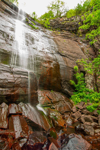 istock Beautiful mountain waterfall bouncing from the red massive rock 1263934172
