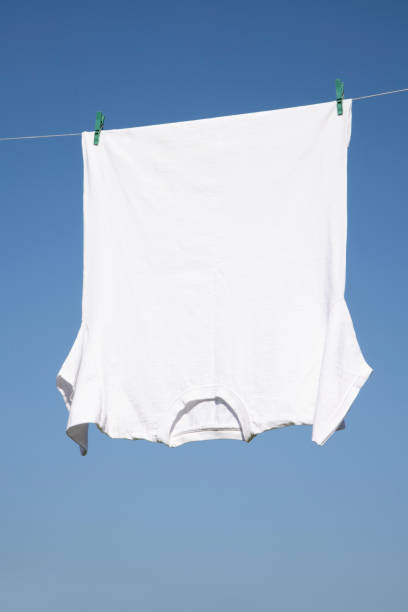 istock White T-shirt hangs on a rope 1263934367
