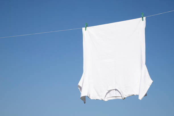 istock White T-shirt hangs on a rope 1263934382