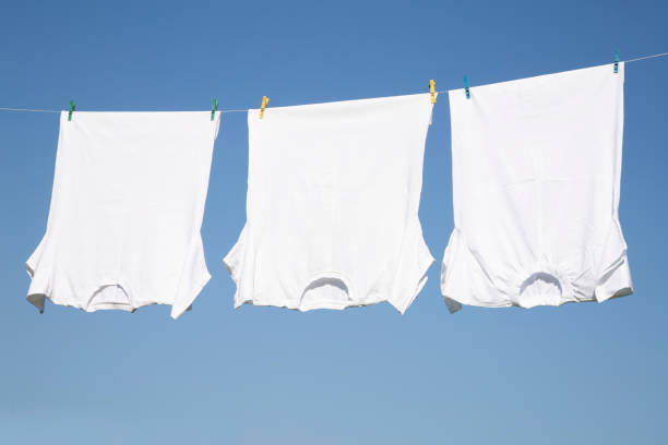istock White T-shirt hangs on a rope 1263934430