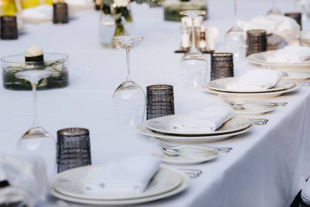 istock tableware Glasses, flower fork, knife served for dinner in restaurant with cozy interior 1263934465